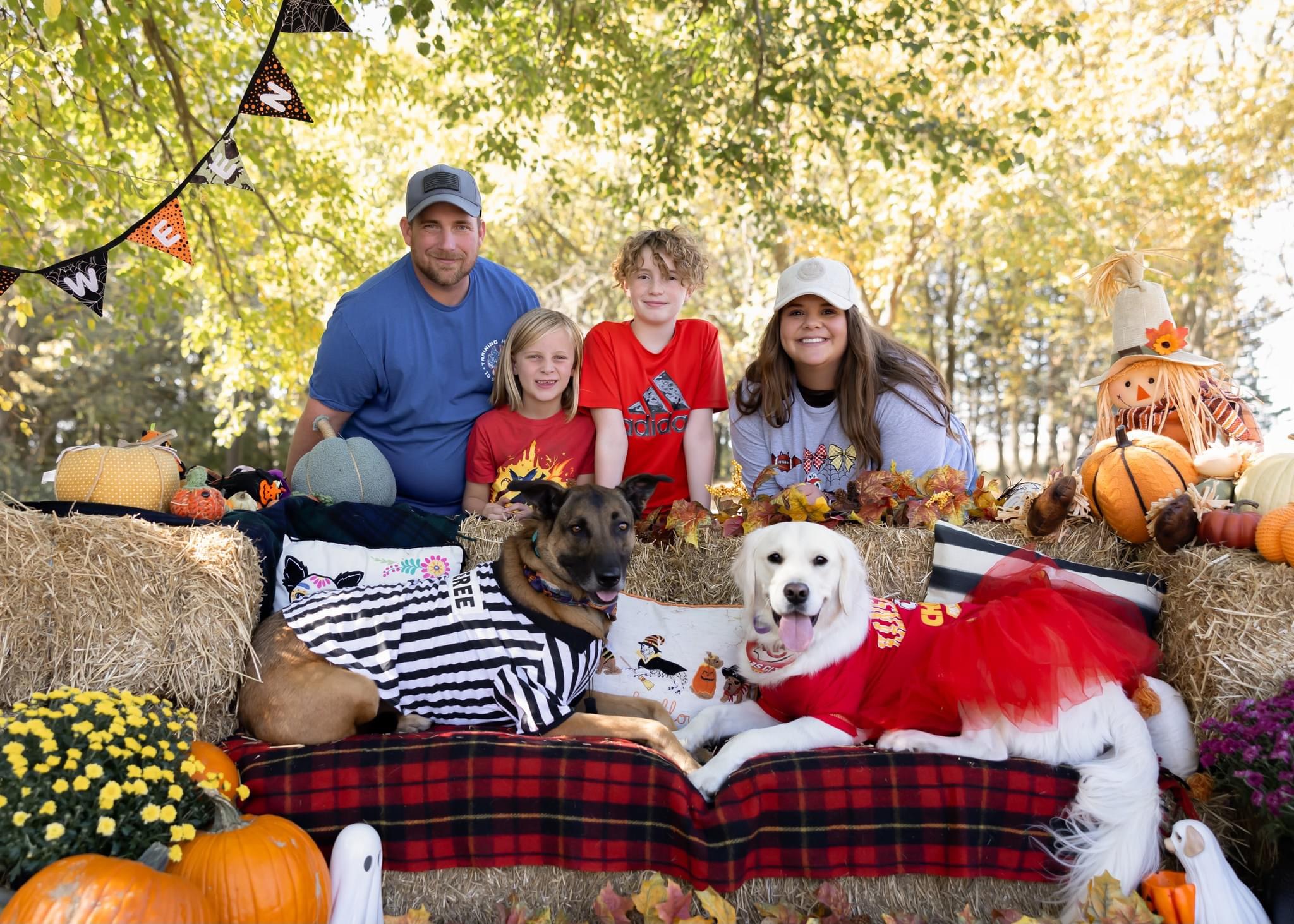 A family with their dogs outdoors